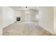 Open living room with vaulted ceilings and a cozy fireplace at 8301 Boseck Dr # 232, Las Vegas, NV 89145