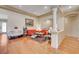 Bright and spacious living room featuring hardwood floors, recessed lighting, and an open floor plan at 9092 National Park Dr, Las Vegas, NV 89178