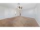 Large bedroom with neutral paint, carpeting, ceiling fan, and multiple access doors at 9409 Kayla Ct, Las Vegas, NV 89134