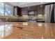 Granite countertop in the kitchen, with stainless steel appliances and modern cabinets in the background at 9409 Kayla Ct, Las Vegas, NV 89134