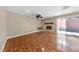 Open living room features a fireplace, ceiling fan, and access to a backyard patio at 9409 Kayla Ct, Las Vegas, NV 89134