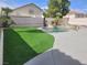 Backyard oasis featuring artificial turf, a fenced perimeter and a pristine pool at 9556 Ancala Hollow Ct, Las Vegas, NV 89148