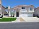 Charming two-story home with three-car garage, landscaped front yard, and updated facade at 9556 Ancala Hollow Ct, Las Vegas, NV 89148