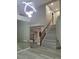 Bright foyer with stylish lighting and staircase offers a welcoming entrance at 9556 Ancala Hollow Ct, Las Vegas, NV 89148