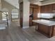 Open-concept kitchen featuring stainless steel appliances and a large island with white countertop at 9556 Ancala Hollow Ct, Las Vegas, NV 89148