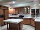 Well-equipped kitchen with island, stainless steel appliances, and spacious layout for entertaining at 9556 Ancala Hollow Ct, Las Vegas, NV 89148