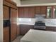 Kitchen with stainless steel appliances, marble backsplash, and large center island at 9556 Ancala Hollow Ct, Las Vegas, NV 89148