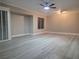 Bright living room with ceiling fan and wood-look floors offers a modern, inviting space at 9556 Ancala Hollow Ct, Las Vegas, NV 89148