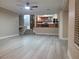 Spacious living room with a view of the kitchen and staircase at 9556 Ancala Hollow Ct, Las Vegas, NV 89148