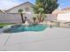 Inviting pool area with lush landscaping and a tranquil water feature at 9556 Ancala Hollow Ct, Las Vegas, NV 89148