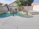 An inviting pool and spa combination surrounded by elegant landscaping and hardscape at 9556 Ancala Hollow Ct, Las Vegas, NV 89148