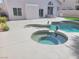 Sparkling pool and hot tub offer a luxurious retreat with a spacious sun deck at 9556 Ancala Hollow Ct, Las Vegas, NV 89148