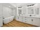Luxurious bathroom features double sinks, a soaking tub, and modern fixtures at 9900 Summer Ash Ct # 103, Las Vegas, NV 89134