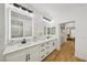 Spacious bathroom features double sinks, lighted mirrors, and a glass-enclosed shower at 9900 Summer Ash Ct # 103, Las Vegas, NV 89134