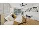 Relaxing bedroom features a ceiling fan, decorative wall, and a sliding glass door to the backyard at 9900 Summer Ash Ct # 103, Las Vegas, NV 89134