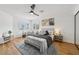 Comfortable bedroom showcasing wood floors, bright windows, and contemporary décor at 9900 Summer Ash Ct # 103, Las Vegas, NV 89134