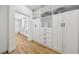 Spacious closet leads to an ensuite bathroom with double vanities and a soaking tub at 9900 Summer Ash Ct # 103, Las Vegas, NV 89134