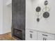 Modern fireplace and built-in storage with white countertop for a clean aesthetic appeal at 9900 Summer Ash Ct # 103, Las Vegas, NV 89134