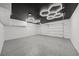 Spacious garage features epoxy flooring, modern lighting and plenty of room for storage at 9900 Summer Ash Ct # 103, Las Vegas, NV 89134