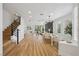 Spacious open living and dining area with modern finishes, hardwood floors, and ample natural light at 9900 Summer Ash Ct # 103, Las Vegas, NV 89134