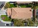 An aerial view shows the layout of the backyard, including a patio, artificial grass, and a well-maintained roof at , Las Vegas, NV 89134