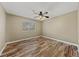 Bright bedroom showcasing sleek wood floors, a ceiling fan, and a large window at , Las Vegas, NV 89134