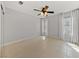Bedroom featuring neutral walls, tile flooring, ceiling fan, and windows with curtain panels at , Las Vegas, NV 89134