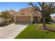 Eye-catching two-story home features a tile roof, lush lawn, and a convenient two-car garage, offering both beauty and practicality at , Las Vegas, NV 89134