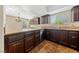 Kitchen with stainless steel dishwasher, granite countertops, and dark wood cabinets at , Las Vegas, NV 89134