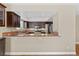 Kitchen pass-through with granite countertop and stainless steel appliances at , Las Vegas, NV 89134
