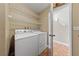 The laundry room is equipped with a washer, dryer, and wire shelving for optimal storage and organization at , Las Vegas, NV 89134