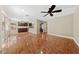 Spacious living room featuring tile floors, a ceiling fan, and dark wood accents at , Las Vegas, NV 89134