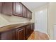 A mud room featuring rich wood cabinets, providing storage space, and a door leading to the exterior at , Las Vegas, NV 89134