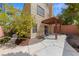 Charming covered patio features a wooden pergola, offering a shaded outdoor space perfect for relaxation or social gatherings at , Las Vegas, NV 89134