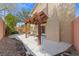 Relaxing covered patio features a wooden pergola, providing a shaded retreat and an ideal space for outdoor entertaining at , Las Vegas, NV 89134