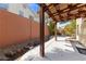 Cozy covered patio features a wooden pergola, providing a shaded retreat and an ideal space for outdoor relaxation at , Las Vegas, NV 89134
