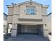 Two-story home with attached two-car garage, neutral color scheme, and stone accents on the first story at 10434 Luna Mezzo St Ave # Lot 188, Las Vegas, NV 89141