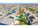 Aerial view of a residential neighborhood with pools, landscaping and solar panels at 10434 Rose Palisade St, Las Vegas, NV 89141