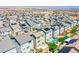 View of a community featuring neatly lined homes, some equipped with solar panels and private pools, against a desert landscape at 10434 Rose Palisade St, Las Vegas, NV 89141