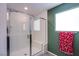 Modern walk-in shower with glass door, seat, and bright window at 10434 Rose Palisade St, Las Vegas, NV 89141