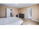 Bedroom with light wood floors offers views of the ensuite and a spacious closet at 10434 Rose Palisade St, Las Vegas, NV 89141