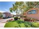 Community entrance with lush landscaping, mature trees and manicured lawn at 10809 Garden Mist Dr # 1042, Las Vegas, NV 89135