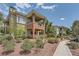 A well-manicured walkway leads up to the exterior of this lovely residential building at 10809 Garden Mist Dr # 1042, Las Vegas, NV 89135