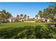 Expansive green space with mature palms and desert landscaping in a welcoming community at 10809 Garden Mist Dr # 1042, Las Vegas, NV 89135