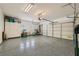 Spacious three car garage featuring an epoxy floor and lots of storage space at 10809 Garden Mist Dr # 1042, Las Vegas, NV 89135