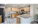 Spacious kitchen with wood cabinets, stainless steel appliances, and granite countertops at 10809 Garden Mist Dr # 1042, Las Vegas, NV 89135