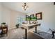 Functional home office featuring a sit-stand desk, ample lighting, and a comfortable workspace at 10809 Garden Mist Dr # 1042, Las Vegas, NV 89135