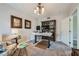 Bright home office with an adjustable desk, charming light fixture, and decorative accents at 10809 Garden Mist Dr # 1042, Las Vegas, NV 89135