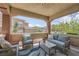 Inviting covered patio with comfortable seating, perfect for relaxation and entertaining at 10809 Garden Mist Dr # 1042, Las Vegas, NV 89135