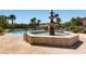 Inviting community pool with a decorative fountain and ample space for relaxation on a sunny day at 10809 Garden Mist Dr # 1042, Las Vegas, NV 89135